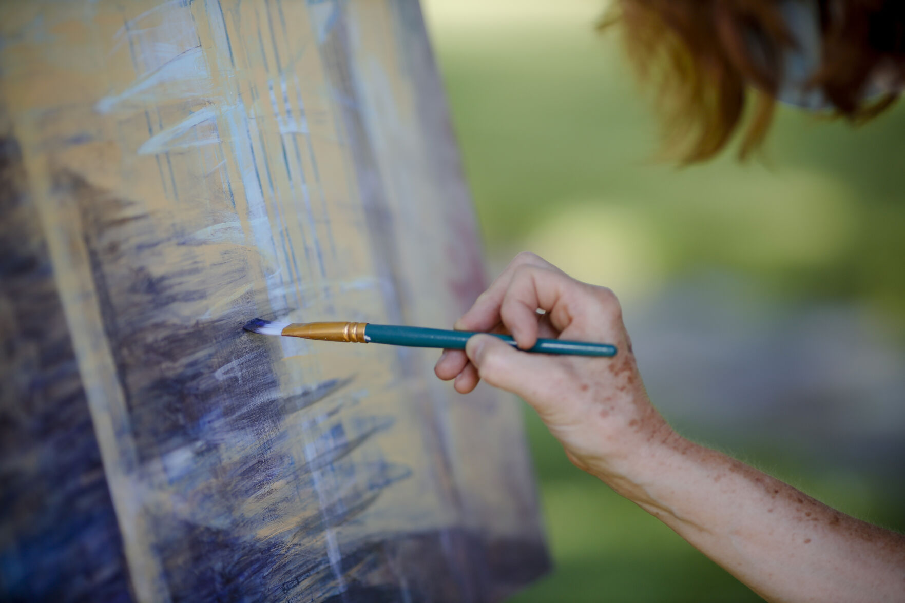 Artist painting on canvas